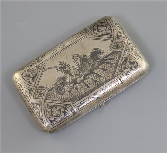 A late 19th century Russian 84 zolotnik silver and niello cigarette case, decorated with scene of a horses with cart,